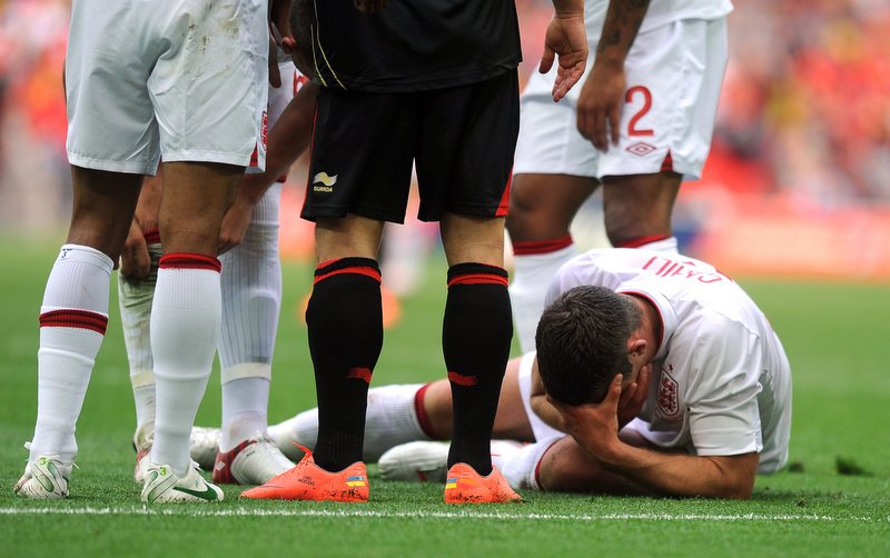 02/06/2012 - International Freidnly - 2011-2012 - England v Belgium - Gary Cahill of England holds his cheek after being pushed into Joe Hart. - Photo: Charlie Crowhurst / Offside.