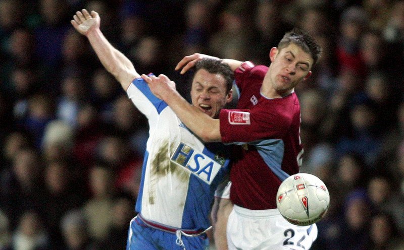 1/3/2005 FA Cup 5th Round Replay. Blackburn Rovers v Burnley. Gary Cahill grabs at Paul Dickov. Photo: Roy Beardsworth / Offside